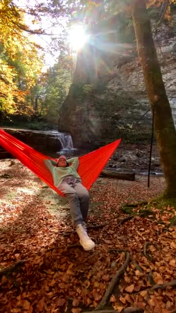 Happy Woman Resting Laying Hammock Waterfall Background Autumn Season — Stock Video