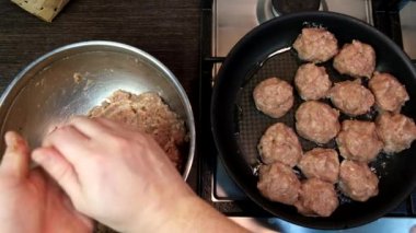 overhead view of frying meatballs on pan domestic food pov