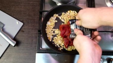 cooking at domestic kitchen overhead view red tomatoes sauce on frying pan healthy food