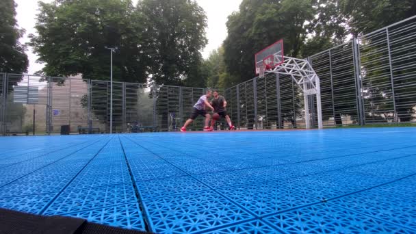 Two Friends Playing Basketball Outdoors Court — Stock Video