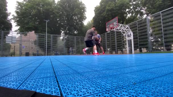 Two Friends Playing Basketball Outdoors Court — Stock Video