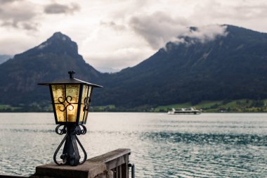 Lantern at Wolfgangsee lake, St. Wolfgang. Austrian Alps mountains, Salzburger land clipart
