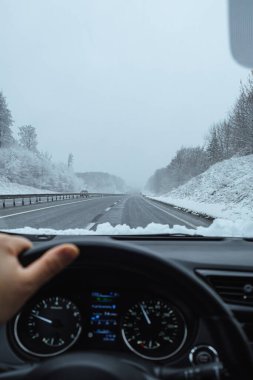 driving by car in winter. ice on roads