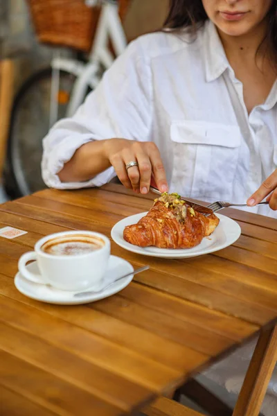 Woman Eats Breakfast Terrace Crispy Croissant Cup Coffee — Stock Photo, Image