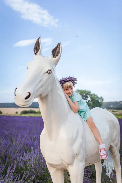 Smiling Girl Sits Decorative Horse Middle Lavender Field — Stock Photo, Image