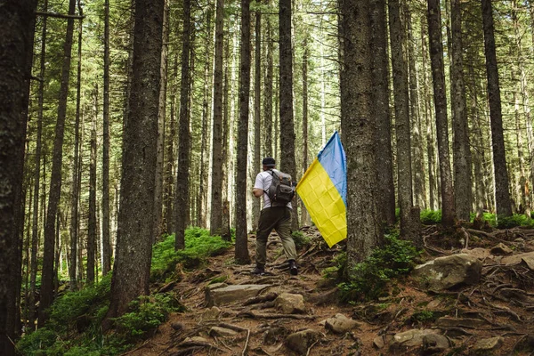 stock image Tourist on Hike with Ukrainian Flag