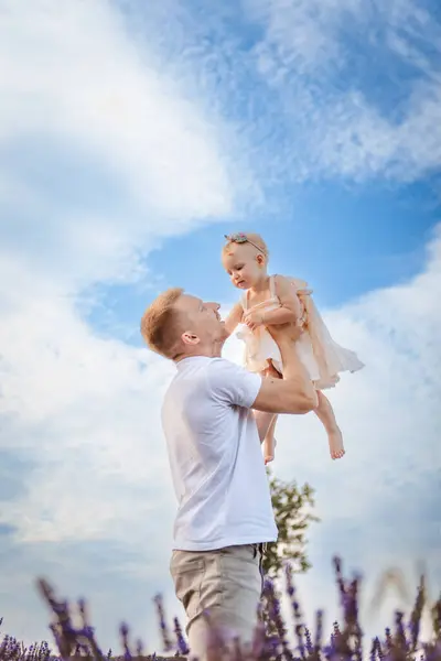 Happy Father Lifts His Daughter Sky Clouds Background — Stock Photo, Image