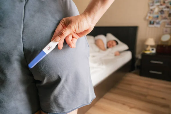 Woman Holding Positive Pregnancy Test Surprise Husband Copy Space — Stock Photo, Image