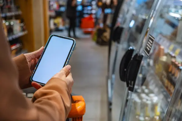 groceries shopping phone in woman hands copy space