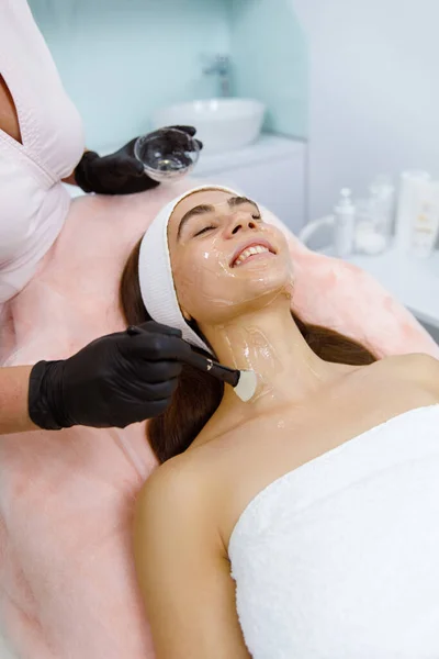 Skin peeling, Facial pampering, Skin exfoliation, Facial cosmetic treatment, Aesthetic procedure, Dermatological procedure, Chemical exfoliation, Skin revitalization