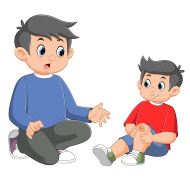 Babası küçük ağlayan oğlunu sakinleştiriyor ve teselli ediyor.