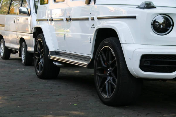 Stock image Surakarta, Indonesia - May 16, 2023: Side view of a Mercedes Benz G-Class AMG G 63 on a parking area. Tyre and alloy wheel. Ceramic brakes. Off-road car.