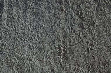 Düşük kontrastlı nötr arkaplan. Gri soyut taş doku arka planı. Arkaplan için alçı dokusu