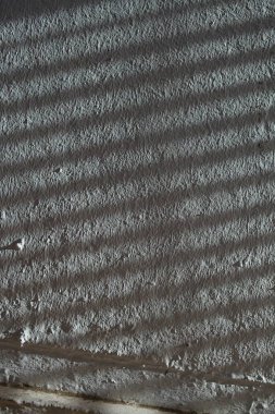 Düşük kontrastlı nötr arkaplan. Gri soyut taş doku arka planı. Arkaplan için alçı dokusu