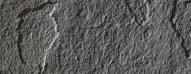 Düşük kontrastlı nötr arkaplan. Gri soyut taş doku arka planı. Arkaplan için alçı dokusu