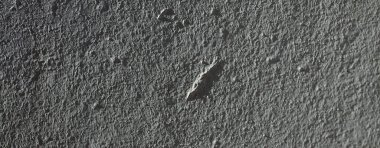 Düşük kontrastlı nötr arkaplan. Gri soyut taş doku arka planı. Arkaplan için alçı dokusu