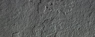 Düşük kontrastlı nötr arkaplan. Gri soyut taş doku arka planı. Arkaplan için alçı dokusu