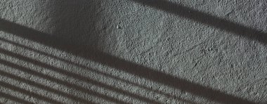 Düşük kontrastlı nötr arkaplan. Gri soyut taş doku arka planı. Arkaplan için alçı dokusu