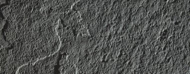 Tarafsız geniş ekran arkaplan. Gri soyut taş doku arka planı. Sıva dokusu