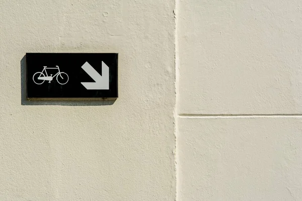bicycle sign on a brick wall. bike and bicycle lane. bicycle bike