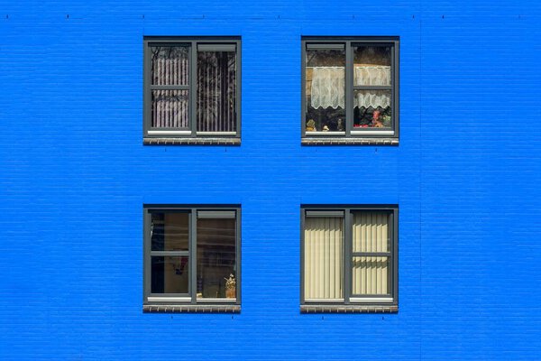 Windows of blue brick building