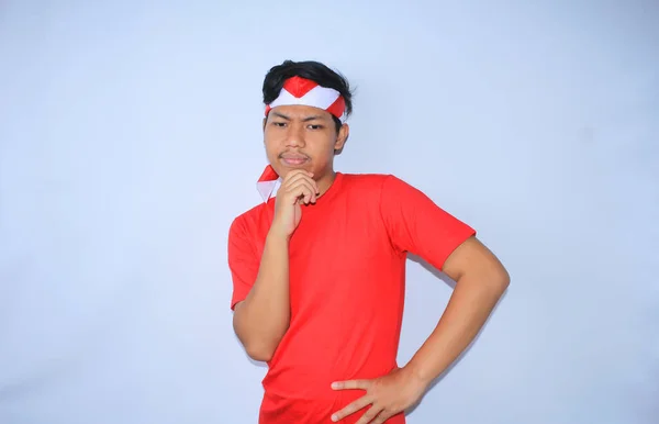 Thoughtful Indonesian Young Man Thinking Suspecting Hands Chin Wearing Red — Stock Photo, Image