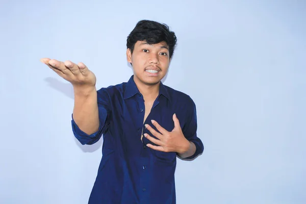 Smiling Asian Young Man Happy Face Raising Hands Showing Offering — Stock Photo, Image