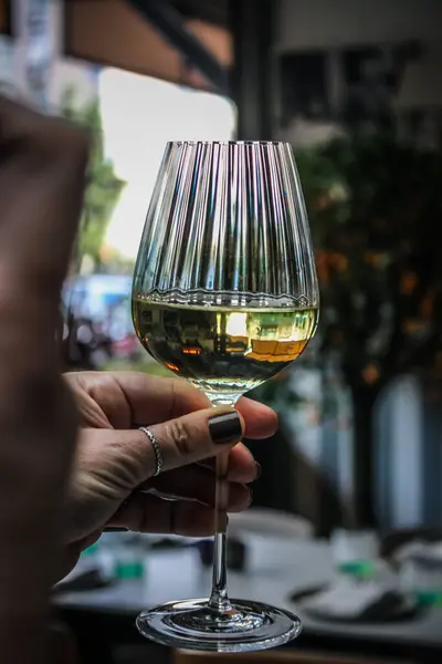 close up of a glass of wine with a blurred background