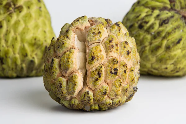 sugar apple ( srikaya ) with black spots, isolated on a white background