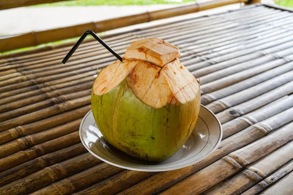Fresh green coconut, young coconut ready to drink