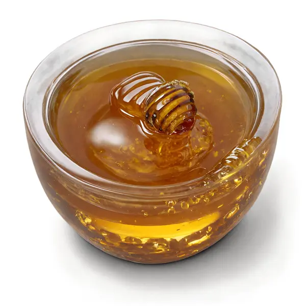 stock image A bowl filled with honey.