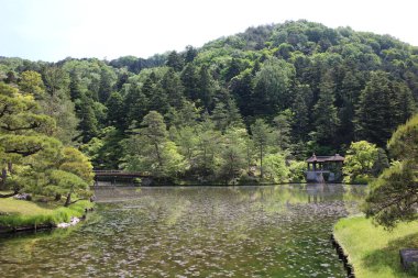 Earthen Bridge, Chitose-bashi Bridge and Yokuryu-chi Pond in Shugakuin Imperial Villa, Kyoto, Japan clipart