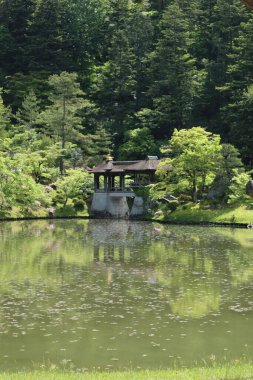 Chitose-bashi Bridge and Yokuryu-chi Pond in Shugakuin Imperial Villa, Kyoto, Japan clipart