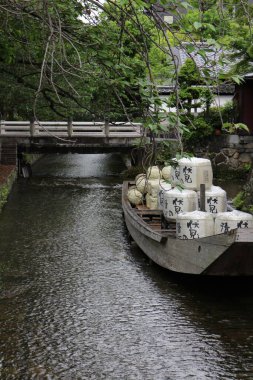 Takasebune at Takase River in Kyoto, Japan clipart