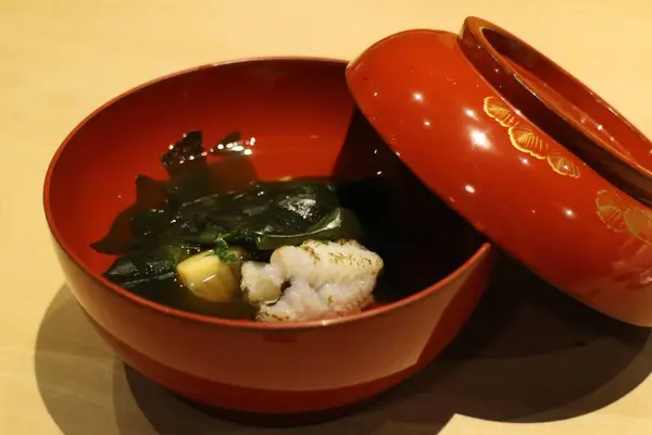 stock image Japanese cuisine : Dashi soup (Stock soup) with hamo (daggertooth pike conger) and takenoko (bamboo shoot) in Kyoto, Japan