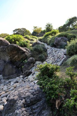 Karetaki (waterfall and river made of stones) in Kiyosumi Garden, Tokyo, Japan clipart