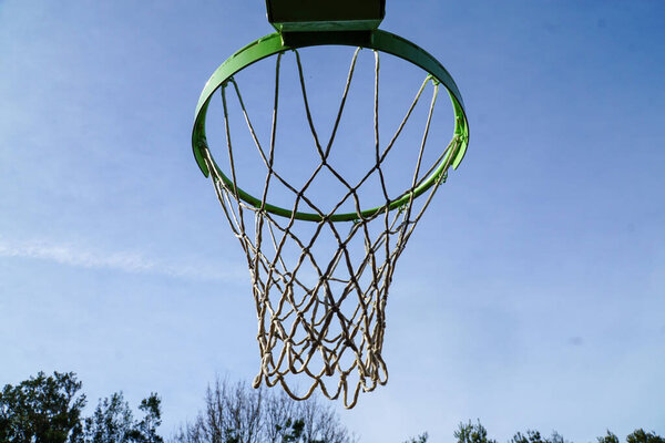 Sky's the Limit: A basketball hoop against a clear sky backdrop, inviting play and endless aspirations.