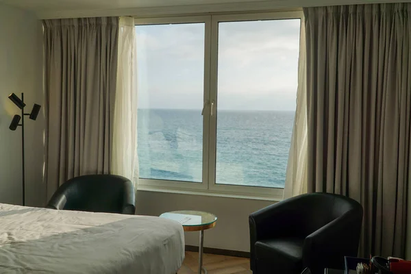 Room with a Spectacular Ocean View: Enjoy the soothing ambiance of a comfortable room while gazing at the endless expanse of the sea.