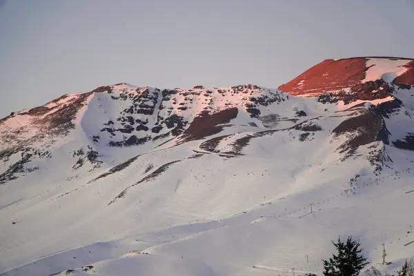 Captivating view of the snow-capped mountain during the golden hour of sunset
