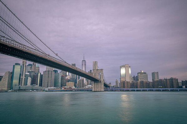 Brooklyn Bridge at Sunrise, New York, with Manhattan skyline in the background