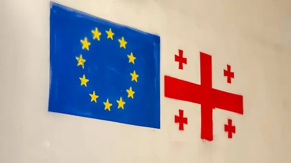 Georgian flag and European Union flag painted on the wall