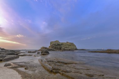 rocks silky water effect and pier with long exposure technique