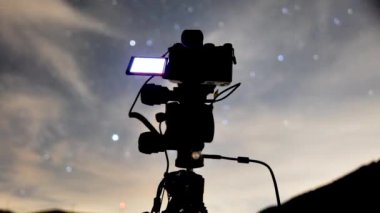 night astro photographing camera equipment shooting 4k time lapse footage stars cables