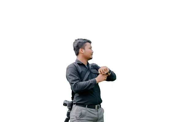 Hombre Posando Sosteniendo Reloj Mientras Mira Izquierda Una Foto Estudio — Foto de Stock