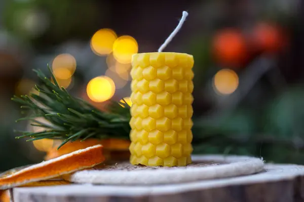 Beeswax candles on dark background