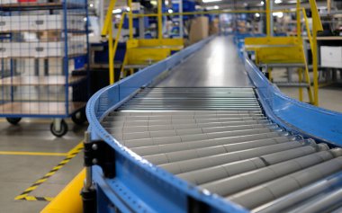 Conveyor belt inside a manufacturing site or distribution warehouse clipart