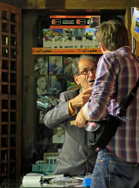 stock image Tehran, Iran - June 10, 2018: A salesman haggles over prices with a tourist in the bazaar of Tehran.