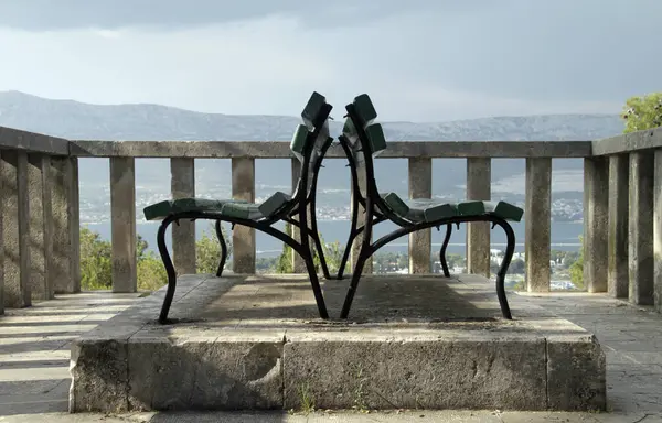 Benches on a view point on a hill next to the city of Split, Croatia