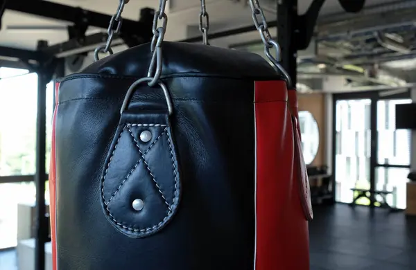 stock image Punching bag hanging from the ceiling in a gym