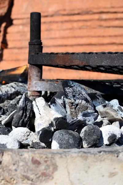 A coal fire is being used to make a fire.